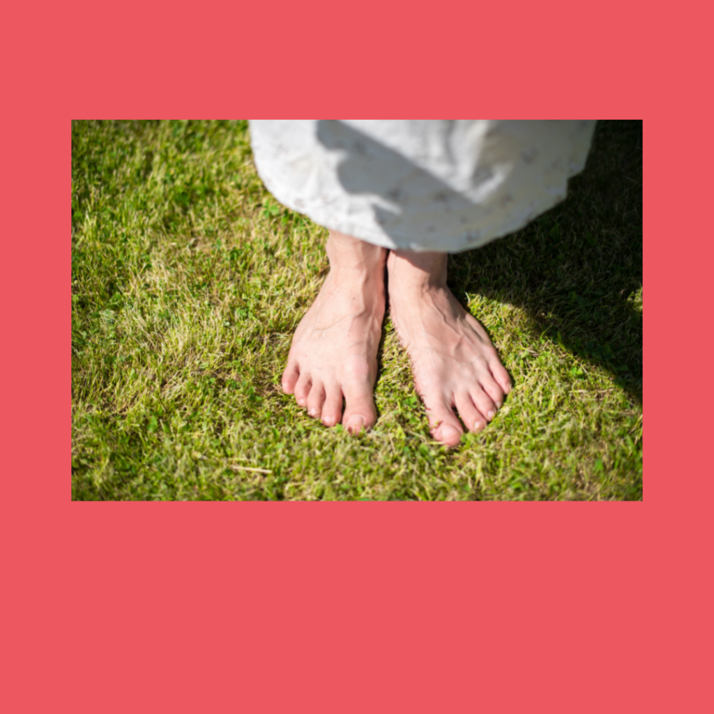 craniosacral therapy somatic experiencing for the anxious body view looking down on light skinned feet on grass